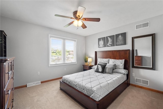 bedroom with light carpet, baseboards, and ceiling fan