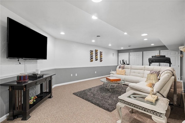 carpeted living area featuring recessed lighting and baseboards