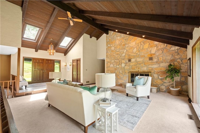 114 Moore Dr, Peters Twp, PA 15317 - carpeted living room with wood ceiling with exposed beams, a skylight, high vaulted ceiling, a ceiling fan, and a stone fireplace