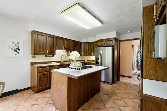 114 Moore Dr, Peters Twp, PA 15317 - kitchen with stainless steel fridge, a sink, a kitchen island, light tile patterned flooring, and gas cooktop