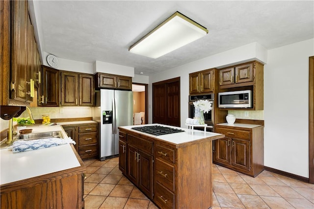 114 Moore Dr, Peters Twp, PA 15317 - kitchen with stainless steel appliances, a sink, a kitchen island, light countertops, and light tile patterned floors