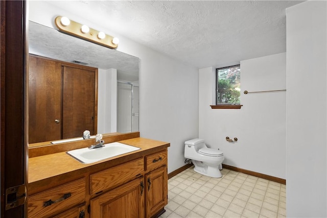 114 Moore Dr, Peters Twp, PA 15317 - full bathroom with baseboards, toilet, a textured ceiling, vanity, and tile patterned floors