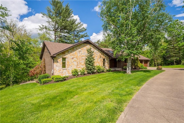 114 Moore Dr, Peters Twp, PA 15317 - view of front of house featuring stone siding, a front lawn, and driveway