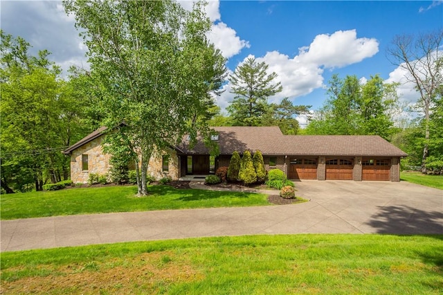 114 Moore Dr, Peters Twp, PA 15317 - view of front facade featuring concrete driveway, stone siding, a front yard, and an attached garage