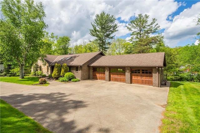 114 Moore Dr, Peters Twp, PA 15317 - view of front of home with a front yard, brick siding, and driveway