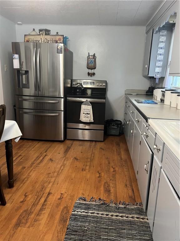 4536 State Route 158, Wilmington Twp, PA 16142 - kitchen featuring appliances with stainless steel finishes, hardwood / wood-style floors, and light countertops