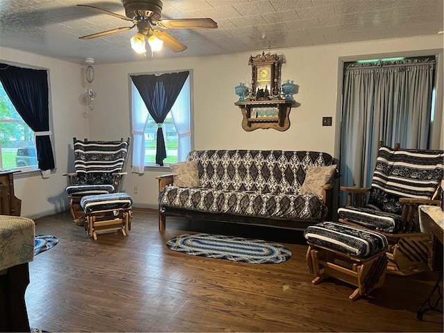 4536 State Route 158, Wilmington Twp, PA 16142 - living area with wood finished floors, a ceiling fan, and baseboards