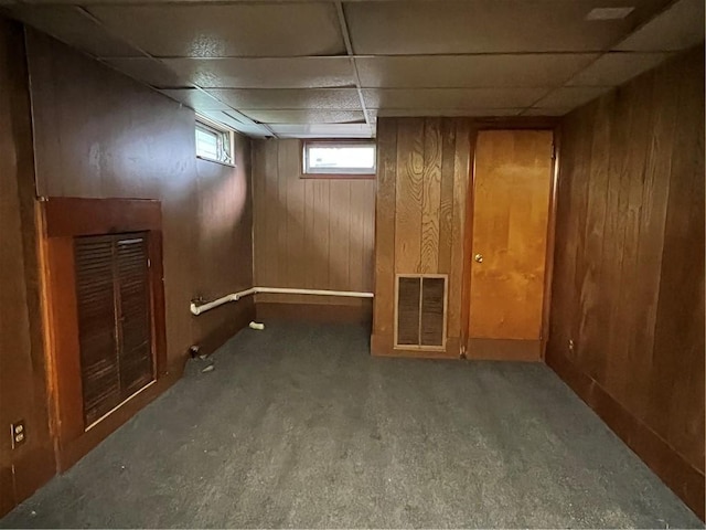 4536 State Route 158, Wilmington Twp, PA 16142 - basement with carpet floors, a drop ceiling, wooden walls, and baseboards