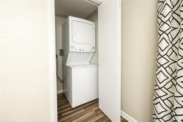 234 E Neshannock Ave, New Wilmington Boro, PA 16142 - washroom with stacked washing machine and dryer and wood finished floors