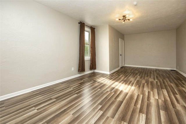 234 E Neshannock Ave, New Wilmington Boro, PA 16142 - empty room with dark wood-style flooring and baseboards