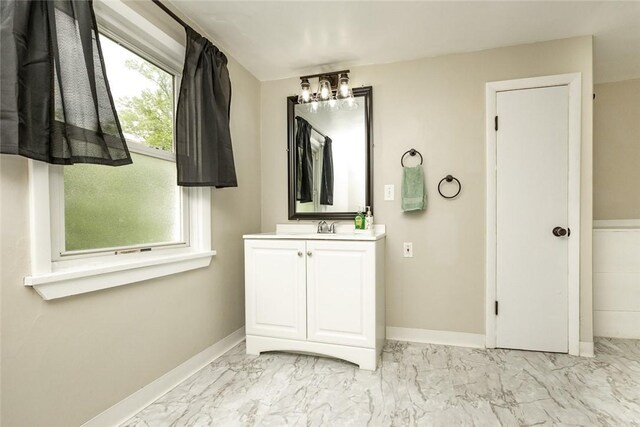 234 E Neshannock Ave, New Wilmington Boro, PA 16142 - bathroom with marble finish flooring, a chandelier, baseboards, and vanity