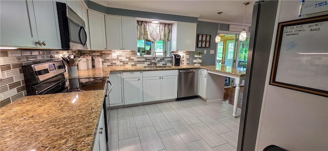 532 Strope Rd, Pa, PA 15021 - kitchen with appliances with stainless steel finishes, a sink, decorative backsplash, ornamental molding, and light stone counters