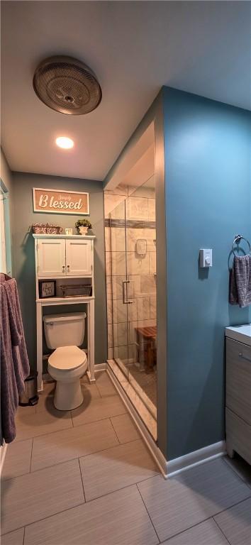 532 Strope Rd, Pa, PA 15021 - full bathroom with a shower stall, vanity, toilet, baseboards, and tile patterned flooring