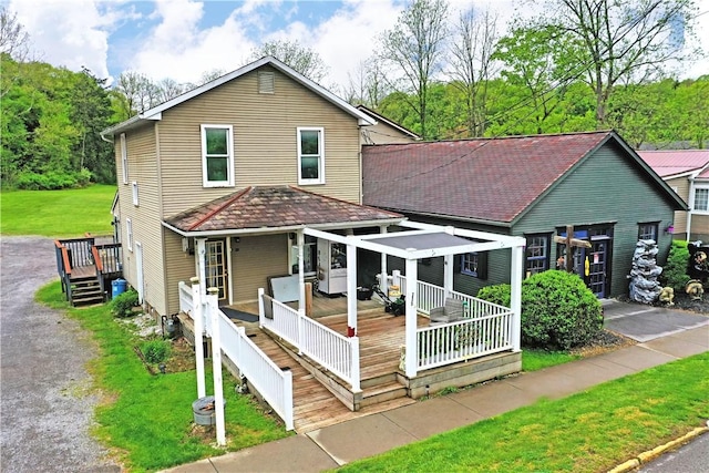 375 Main St, Volant Boro, PA 16156 - view of front of house with a front lawn and a wooden deck