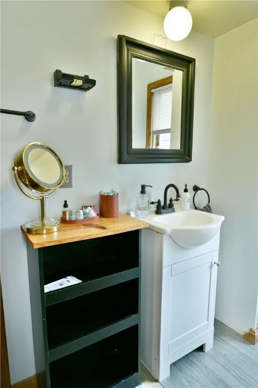 375 Main St, Volant Boro, PA 16156 - bathroom featuring vanity and wood finished floors