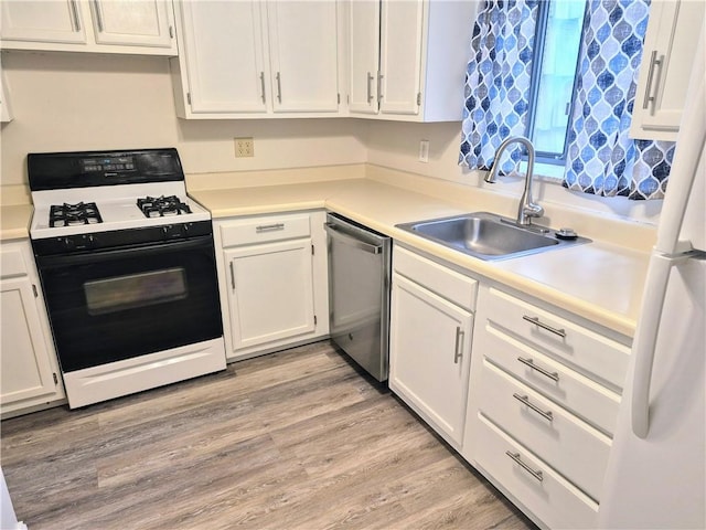 kitchen featuring stainless steel dishwasher, gas range oven, a sink, white cabinets, and light countertops