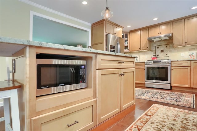 kitchen with stainless steel appliances, under cabinet range hood, crown molding, light wood-type flooring, and glass insert cabinets