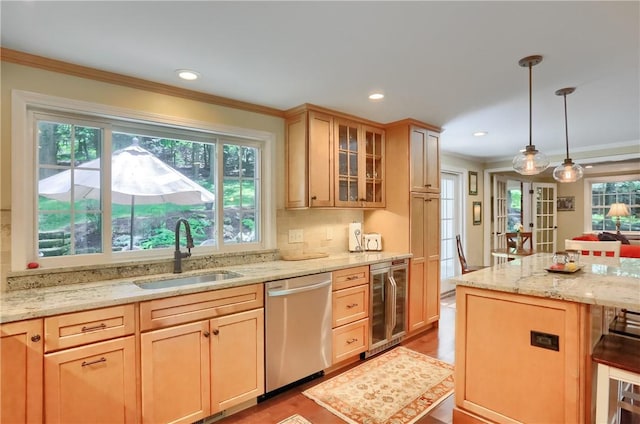kitchen featuring wine cooler, stainless steel dishwasher, a sink, ornamental molding, and glass insert cabinets