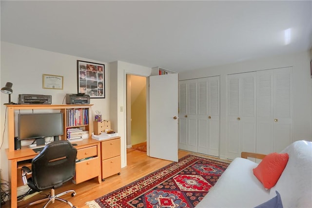 office space with light wood-style floors