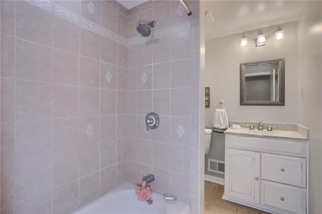 bathroom featuring bathing tub / shower combination, tile patterned floors, and vanity