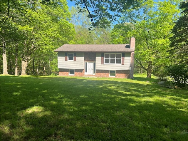 150 Long Hill Rd, Salem Twp Mer, PA 16130 - split foyer home featuring a chimney and a front yard