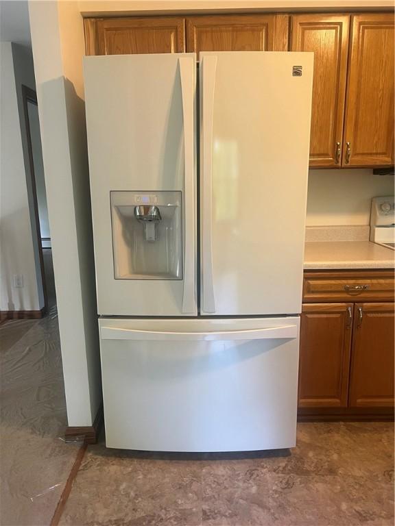 150 Long Hill Rd, Salem Twp Mer, PA 16130 - kitchen view of white fridge with ice dispenser, brown cabinets, and light countertops