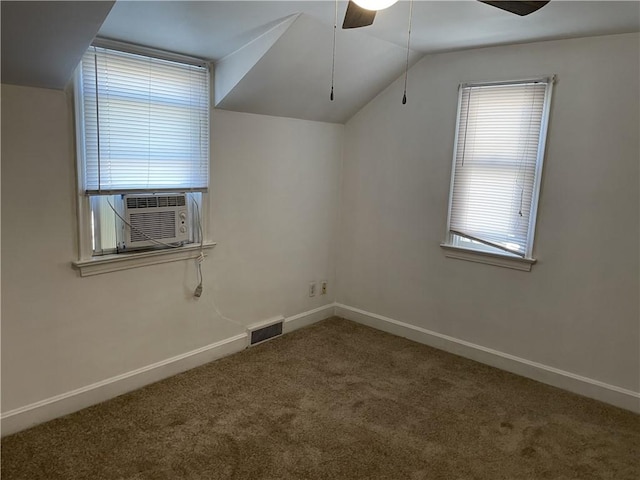 additional living space featuring carpet, cooling unit, baseboards, a ceiling fan, and lofted ceiling