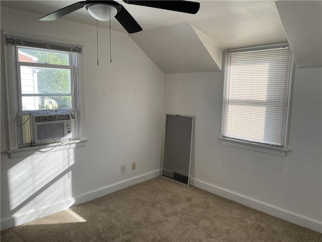 additional living space featuring carpet floors, ceiling fan, baseboards, cooling unit, and vaulted ceiling
