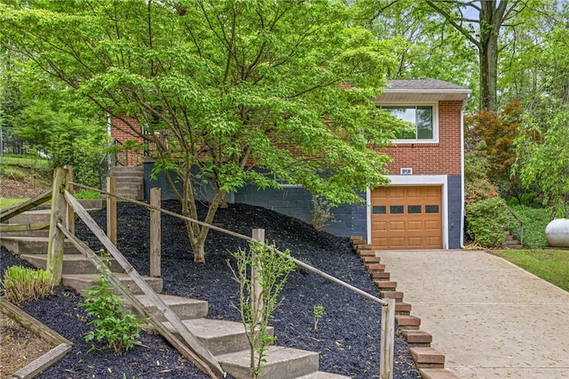 318 Milbren Dr, Penn Hills, PA 15147 - view of front of house featuring driveway, stairway, and brick siding