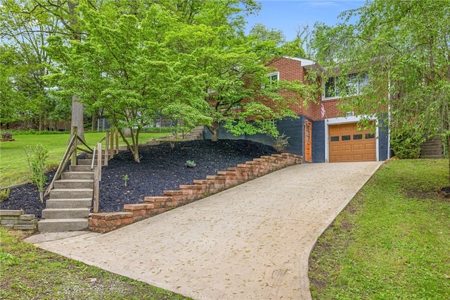 318 Milbren Dr, Penn Hills, PA 15147 - view of front of property featuring brick siding, concrete driveway, an attached garage, stairs, and a front yard