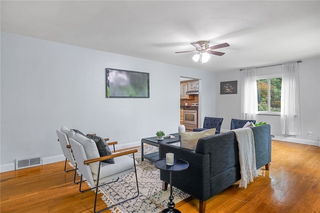 318 Milbren Dr, Penn Hills, PA 15147 - living room with wood finished floors, a ceiling fan, and baseboards