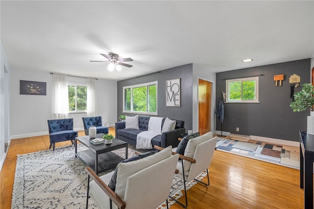 318 Milbren Dr, Penn Hills, PA 15147 - living area featuring wood finished floors, a ceiling fan, and baseboards