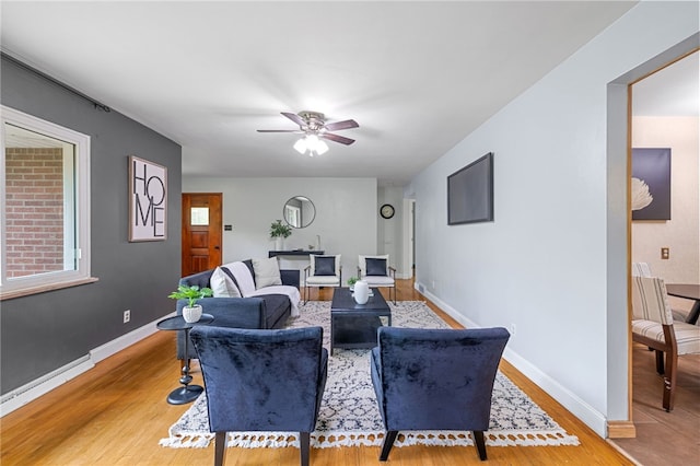 318 Milbren Dr, Penn Hills, PA 15147 - living area featuring light wood-style floors, ceiling fan, and baseboards