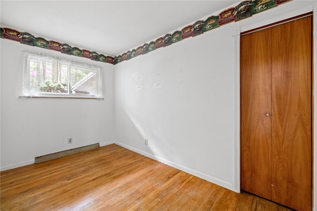 318 Milbren Dr, Penn Hills, PA 15147 - unfurnished bedroom with light wood-style flooring, a closet, and baseboards