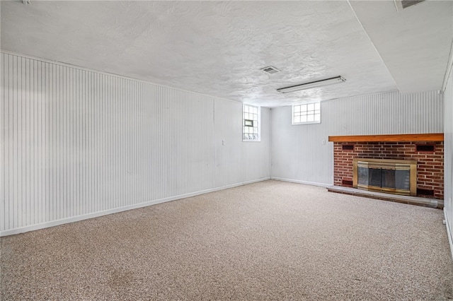 318 Milbren Dr, Penn Hills, PA 15147 - basement featuring a brick fireplace, carpet floors, and a textured ceiling