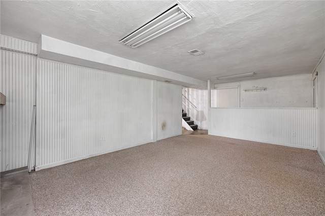 318 Milbren Dr, Penn Hills, PA 15147 - finished basement featuring stairway and a textured ceiling