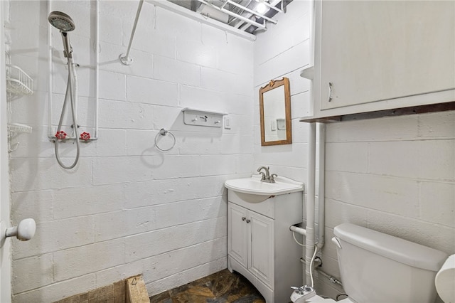 318 Milbren Dr, Penn Hills, PA 15147 - full bathroom featuring concrete block wall, vanity, toilet, and a shower