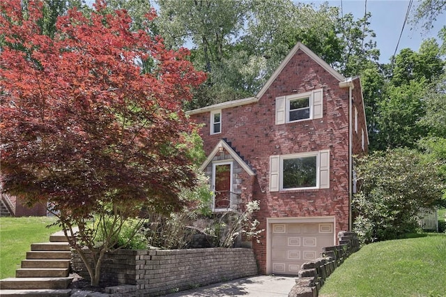 7 Earlswood Ave, Mt Lebanon, PA 15228 - view of front of home featuring an attached garage, concrete driveway, a front yard, and stairway