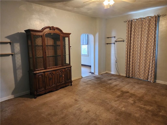 421 32nd St, Mckeesport, PA 15132 - unfurnished bedroom featuring carpet flooring, a ceiling fan, arched walkways, and baseboards