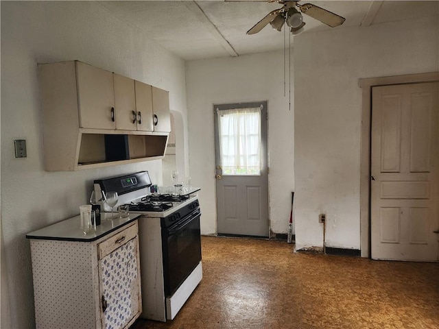 421 32nd St, Mckeesport, PA 15132 - kitchen with range with gas stovetop, tile patterned floors, and a ceiling fan