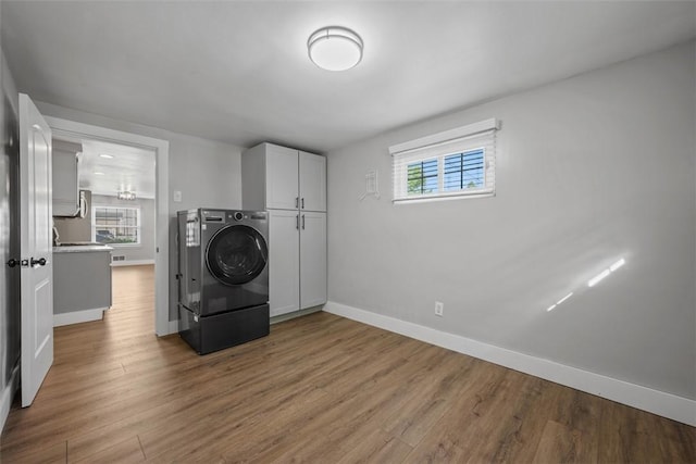 13 Chestnut St, South Fayette, PA 15082 - clothes washing area with cabinet space, baseboards, wood finished floors, and washer / dryer