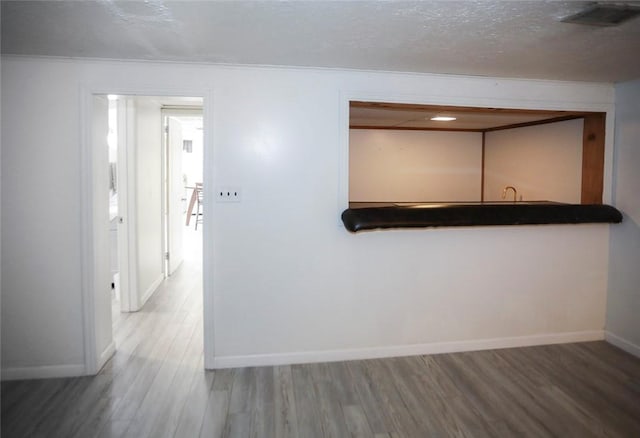 107 Great Oaks Dr, Moon/Crescent Twp, PA 15108 - empty room with wood finished floors, baseboards, and a textured ceiling