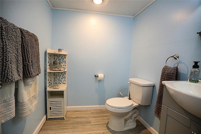 107 Great Oaks Dr, Moon/Crescent Twp, PA 15108 - half bath featuring crown molding, wood finished floors, baseboards, toilet, and vanity