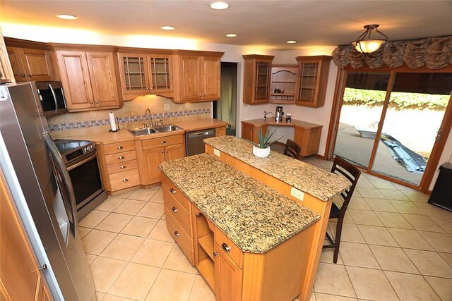 107 Great Oaks Dr, Moon/Crescent Twp, PA 15108 - kitchen featuring a sink, appliances with stainless steel finishes, a kitchen island, light tile patterned floors, and recessed lighting