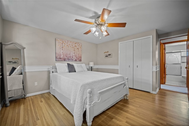 bedroom with light wood-style floors, a closet, baseboards, and ceiling fan