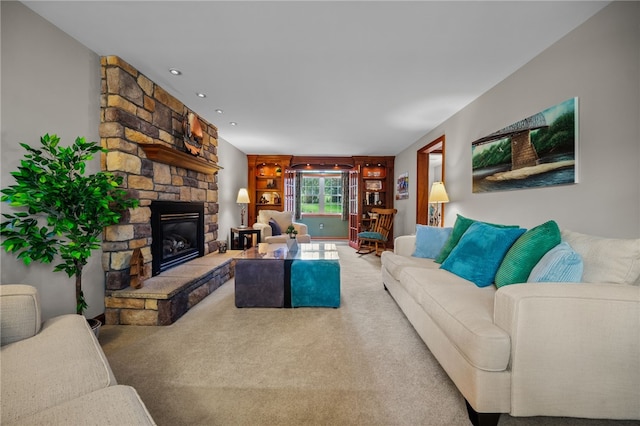 carpeted living area with a fireplace and recessed lighting