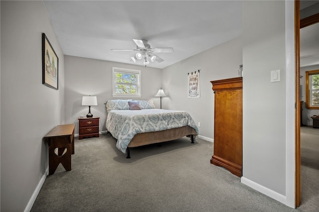 bedroom featuring carpet, baseboards, and ceiling fan