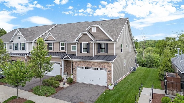 3033 Mahican Cir, Marshall, PA 16046 - view of front of property with a standing seam roof, an attached garage, driveway, a shingled roof, and metal roof