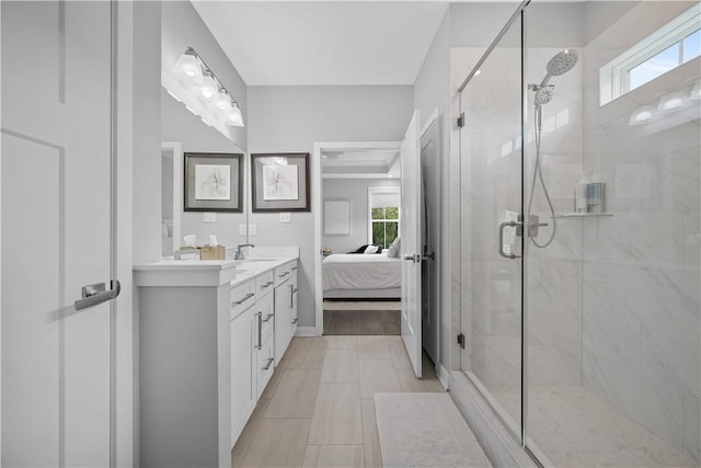 3033 Mahican Cir, Marshall, PA 16046 - ensuite bathroom featuring a stall shower, double vanity, and baseboards