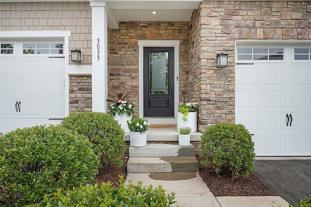 doorway to property featuring an attached garage